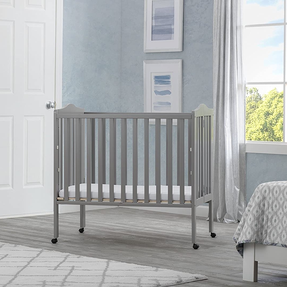

Delta children portable folding crib grey