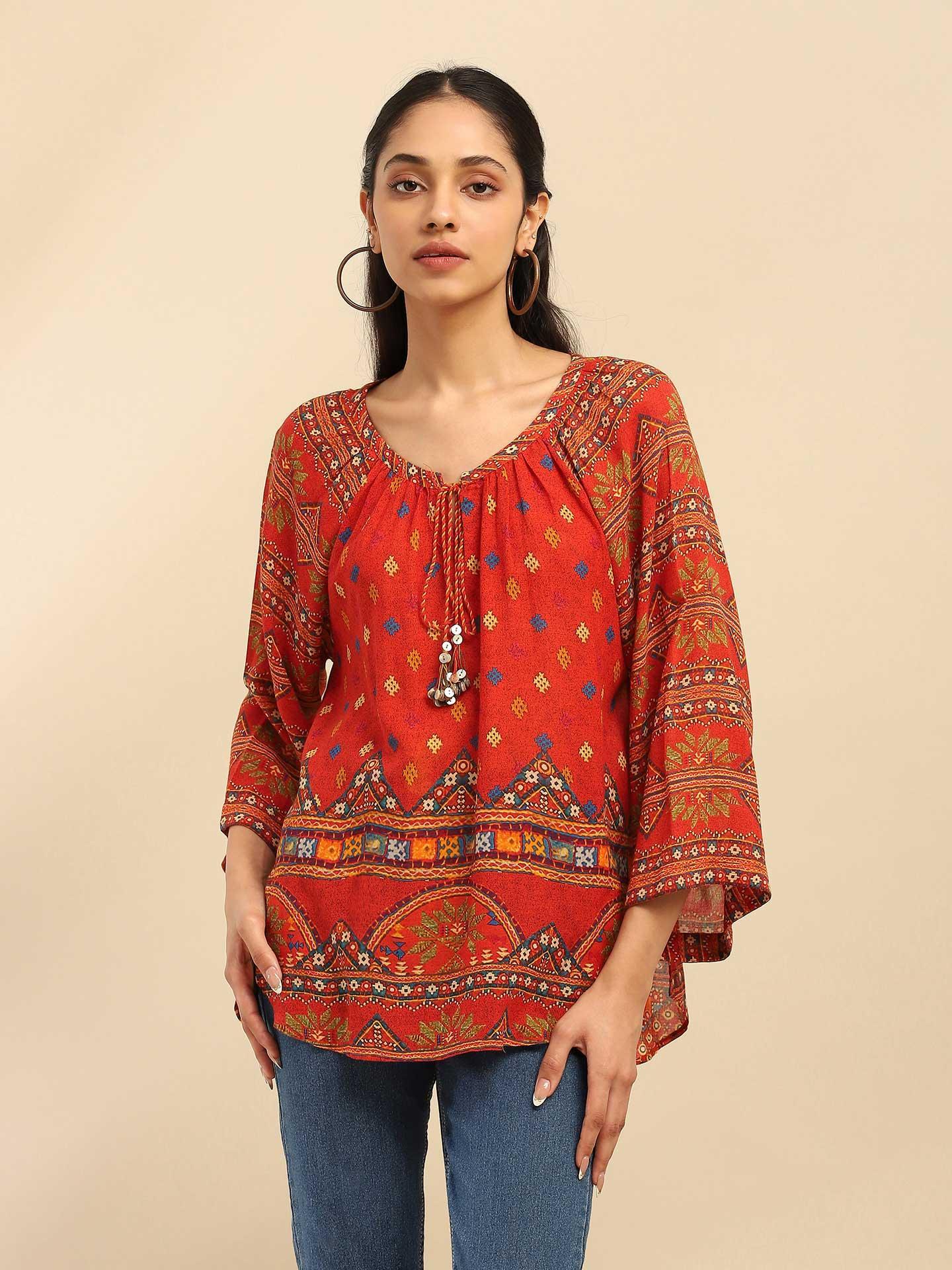 orange peasant top