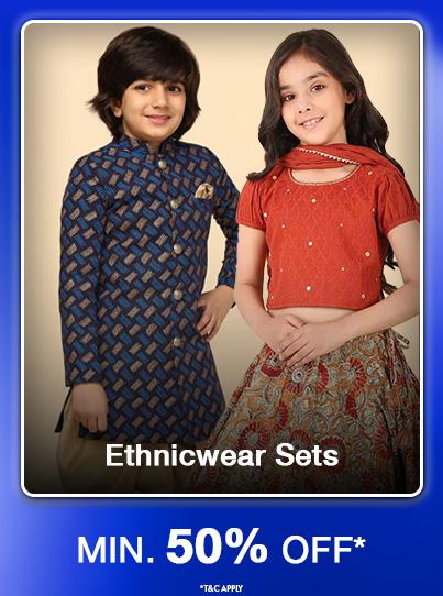 Minimum fifty percent off kids ethnicwear sets. Boy in blue patterned kurta and girl in red lehenga.