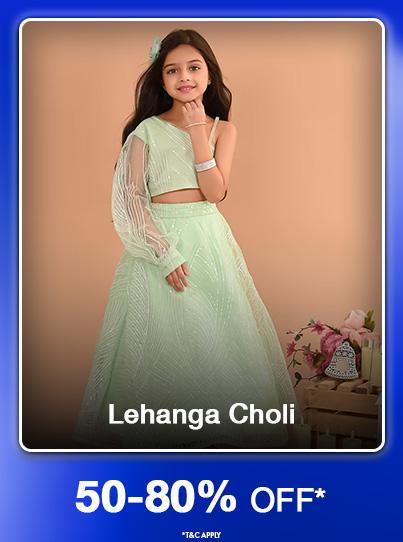 50 to 80 percent off Lehenga Choli. Girl models a light green embroidered traditional skirt and crop top.