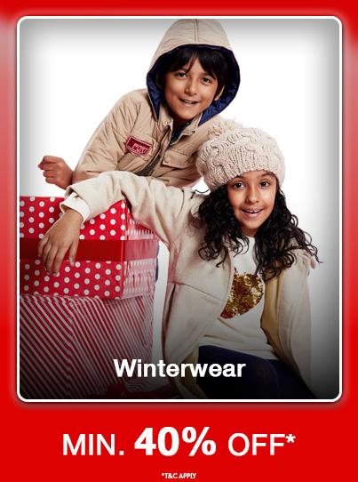 Minimum forty percent off Winterwear. Boy in a tan jacket and girl in a knit hat advertise the sale with stacked gift boxes.