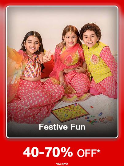 40 to 70 percent off festive kids clothing. Three happy children in traditional pink and yellow outfits playing a board game.