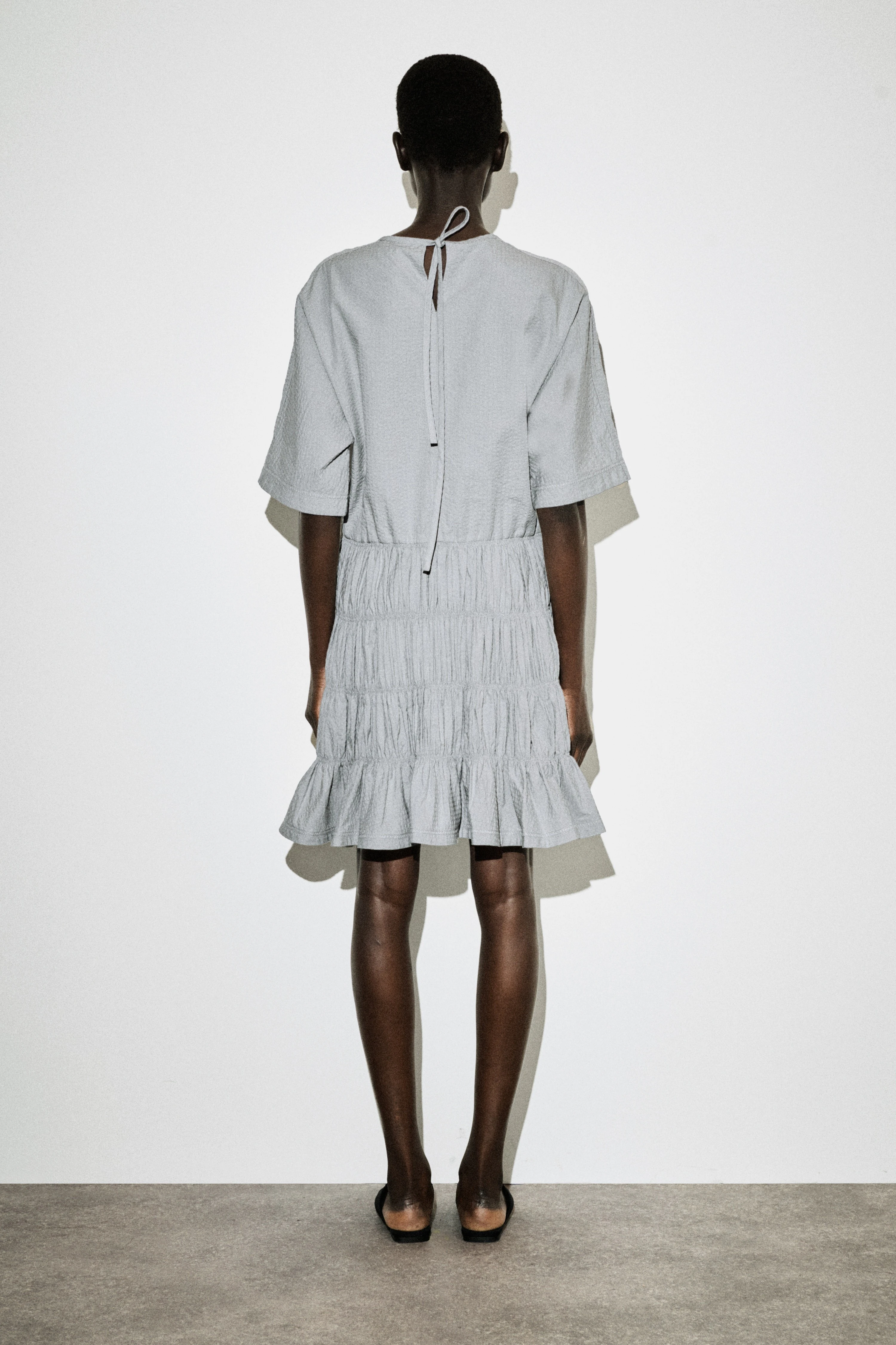 SMOCKED SEERSUCKER MINI DRESS