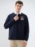 VARSITY PREP MULTI BADGE POLO STYLE