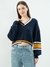 ASYMMETRIC BADGE SWEATER