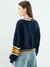 ASYMMETRIC BADGE SWEATER