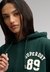 ATHLETIC ESSENTIAL APPLIQUE CROP HOOD