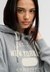 ATHLETIC ESSENTIAL APPLIQUE CROP HOOD