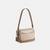 Mini Carey Crossbody Bag In Signature Canvas