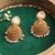 The Nila Gold Plated Pink and White Drop Jhumkas