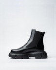 Black Bootswith A Rounded Toe And Chunky Sole