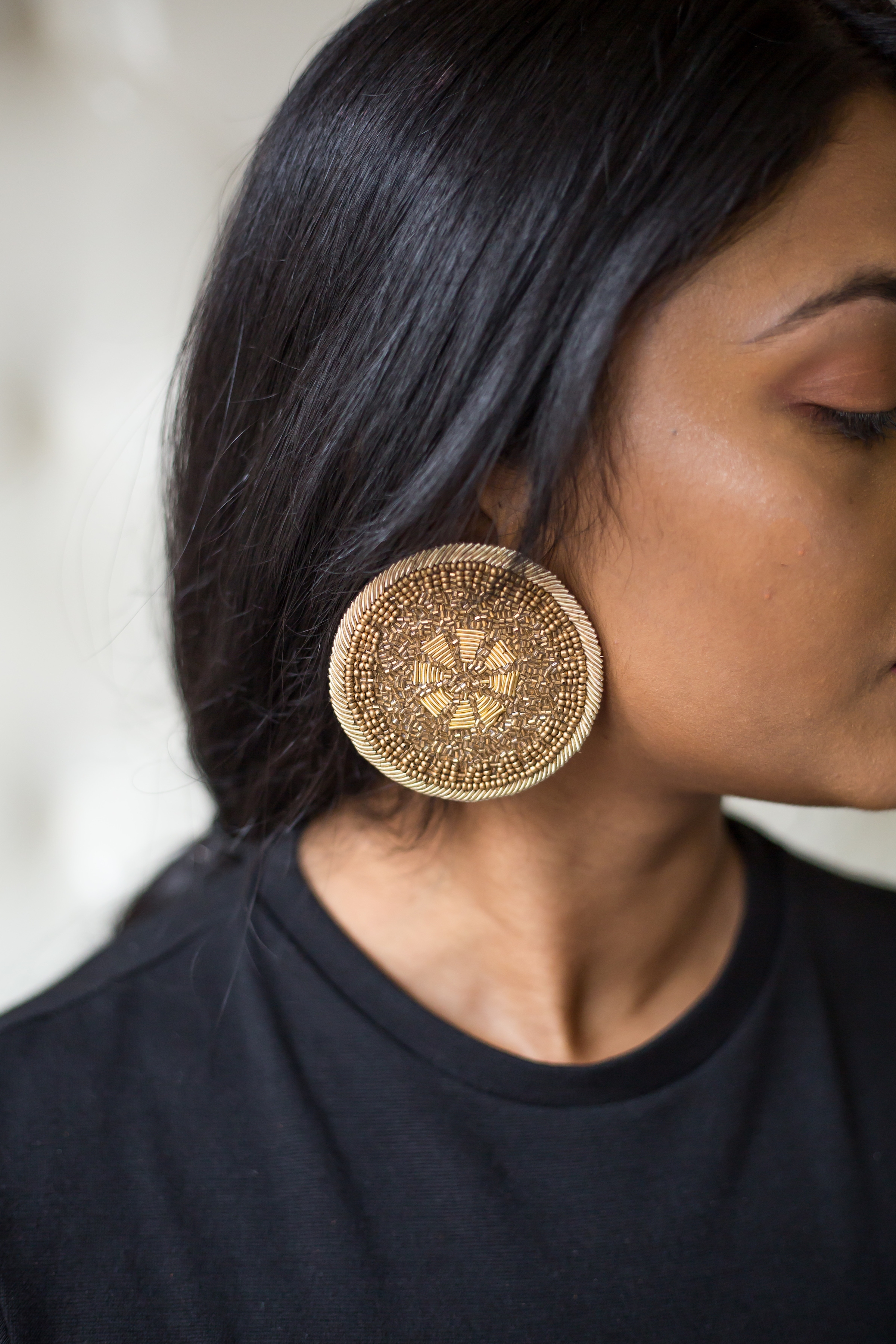 Gold wheel earrings