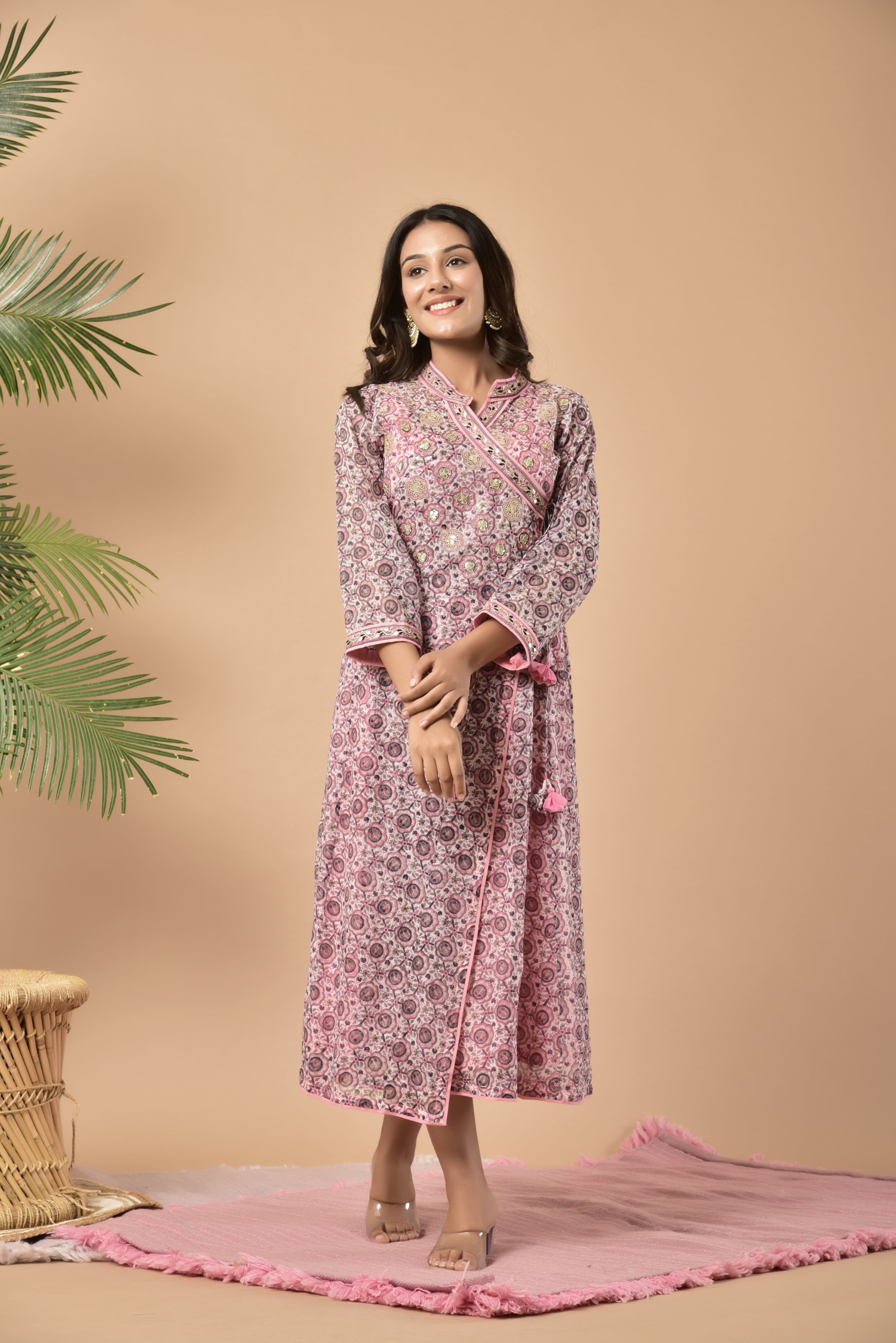 Block printed angrakha kurta with highlighted border on the neck and on the edge of the sleeves this has tassels on the side and has a seperate slip