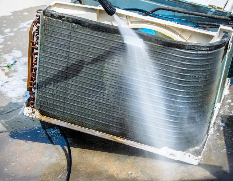 resQ certified technician servicing an air conditioner