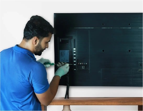 resQ technician repairing television back panel and PCB