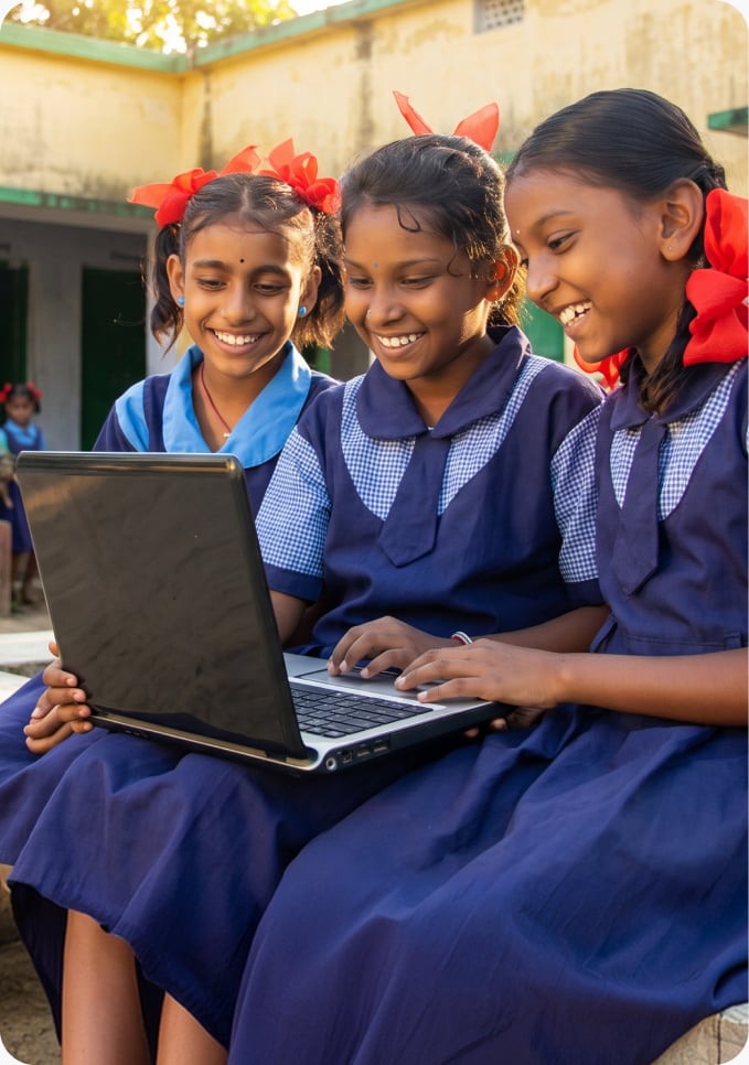 A student using a laptop and modern learning equipment