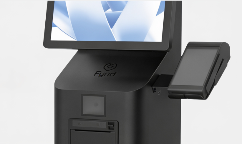Close-up of a Fynd self-checkout kiosk with touchscreen and receipt printer