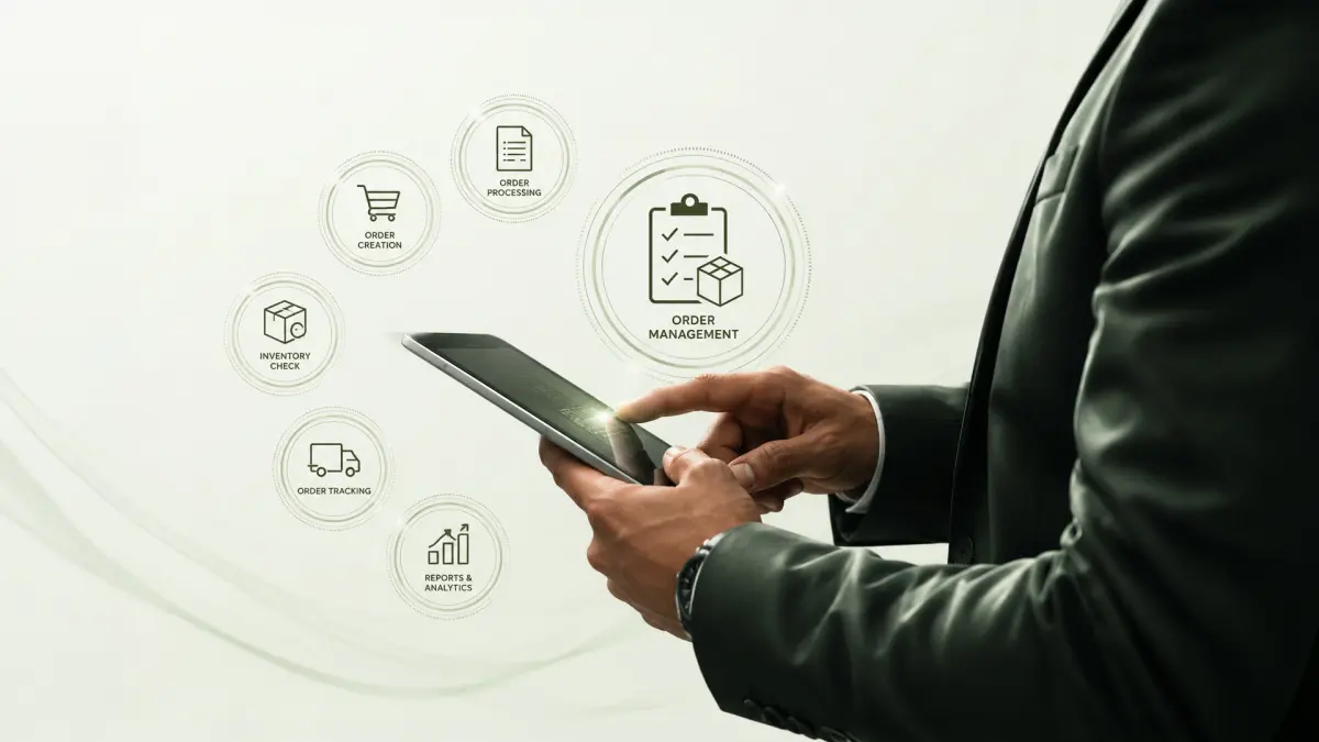 An image showing a person handling orders management under one single automated system