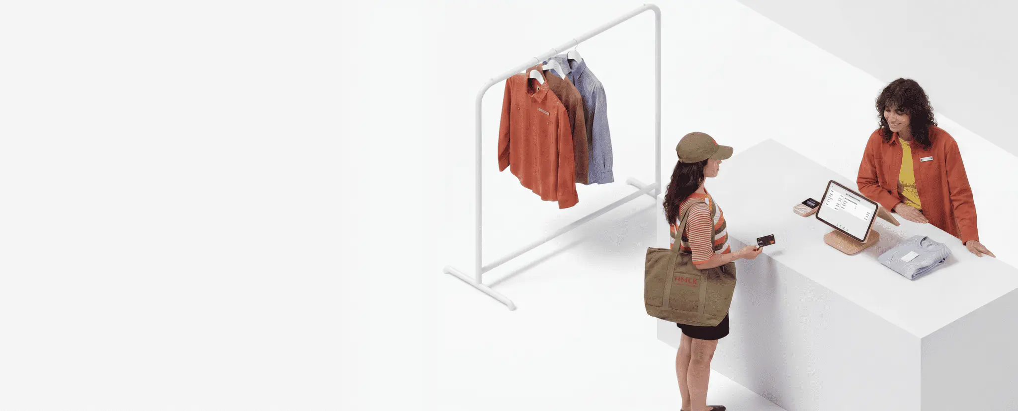 Retail associate using an AI-powered POS tablet to bill a customer at checkout, with a clothing rack in the background