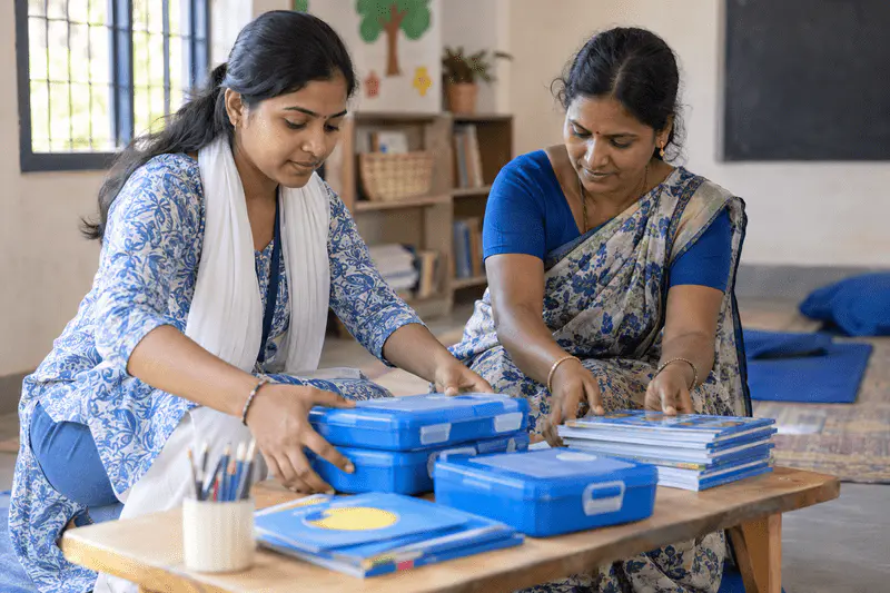 Community members supporting a hands-on learning activity