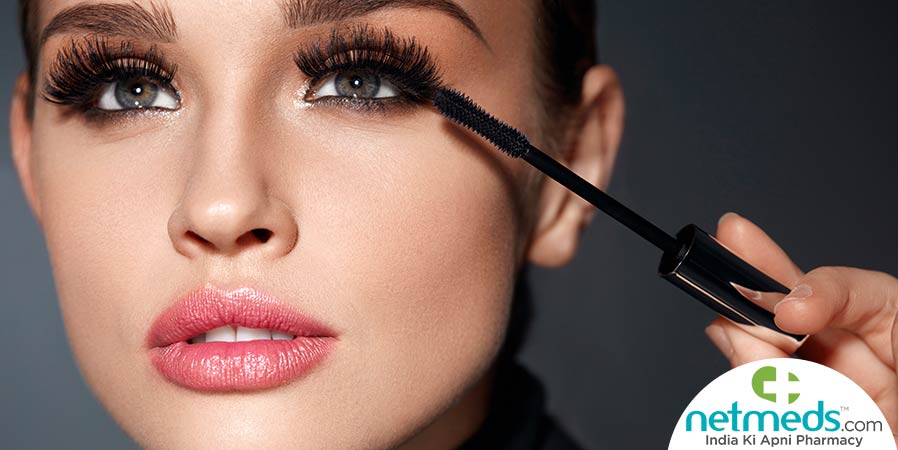 Woman doing eye makeup