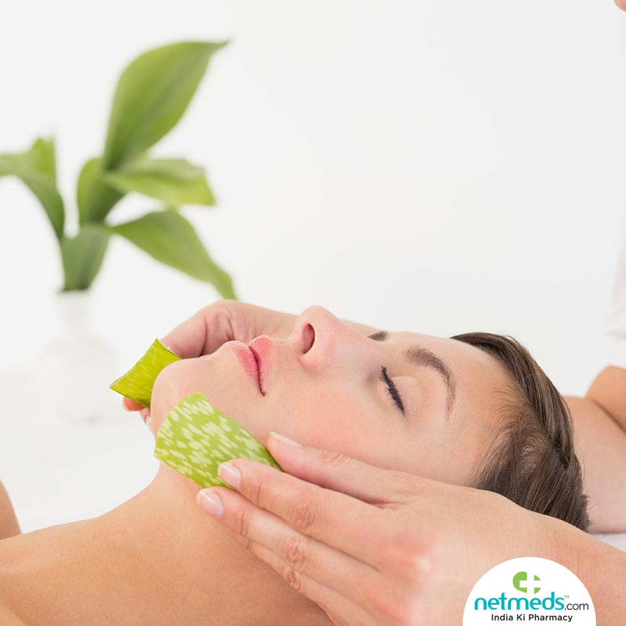 applying aloe vera on face