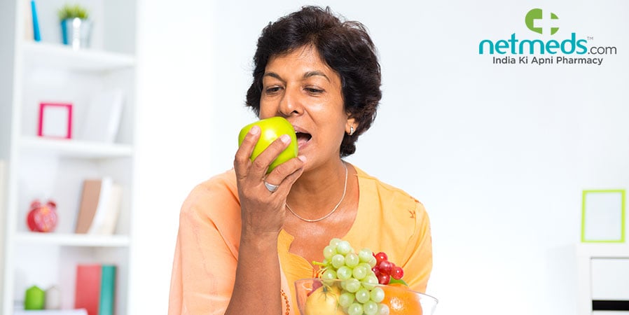 Woman eating an apple