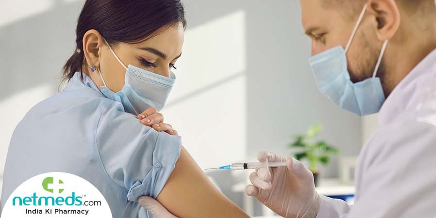 Doctor giving vaccine to the patient