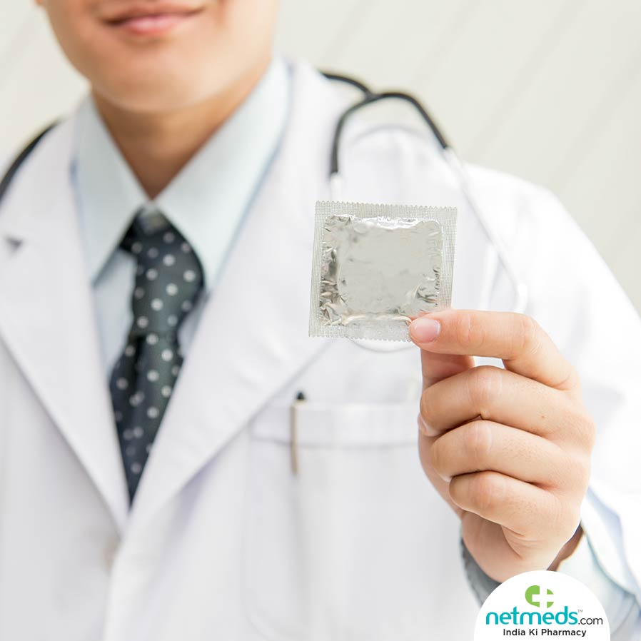 Doctor Showing Condom Pack