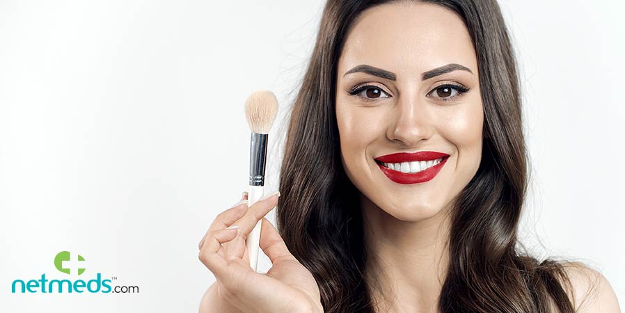 Woman with foundation brush in hand