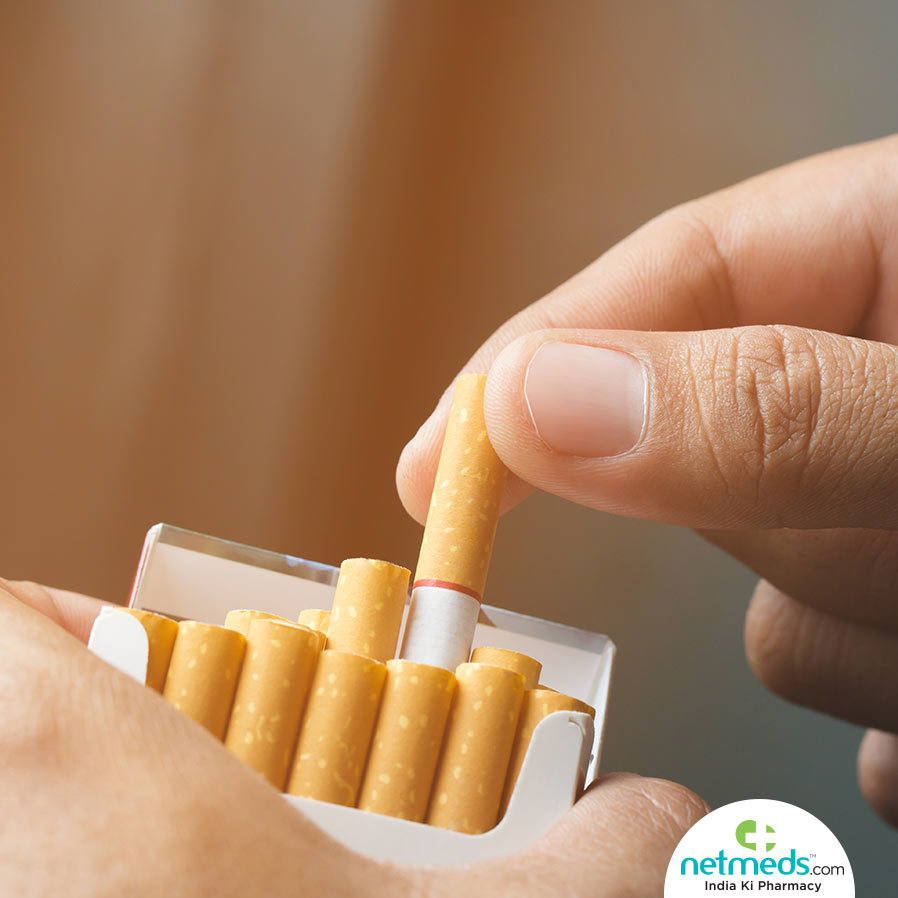 hand taking cigarettes from the pack