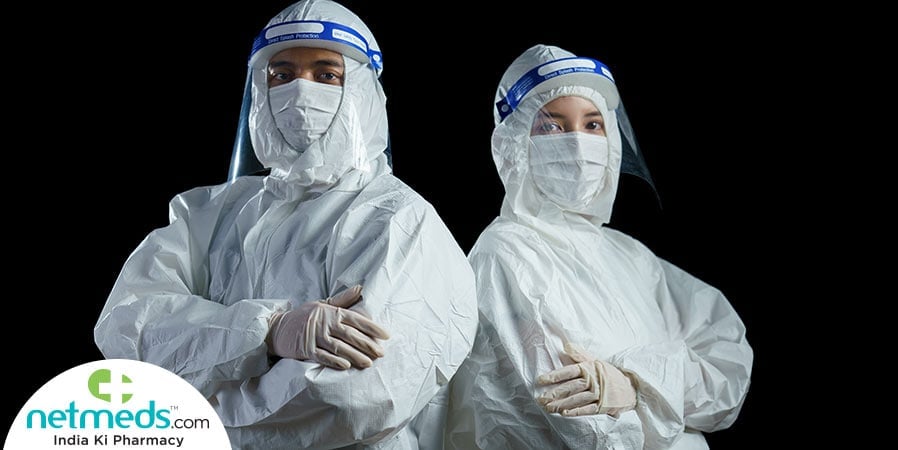 Man and woman wearing PPE