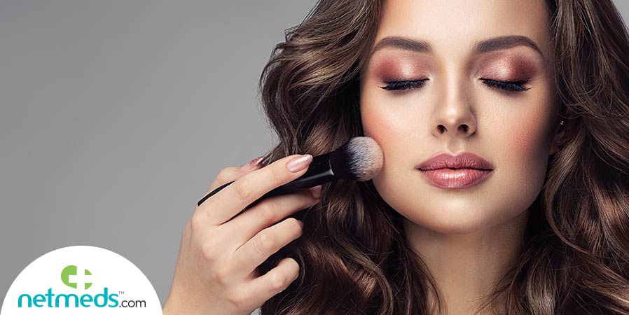 Woman applying highlighter