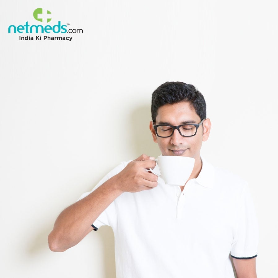 A Man Smelling Coffee