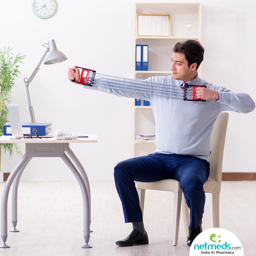 Man exercising in office