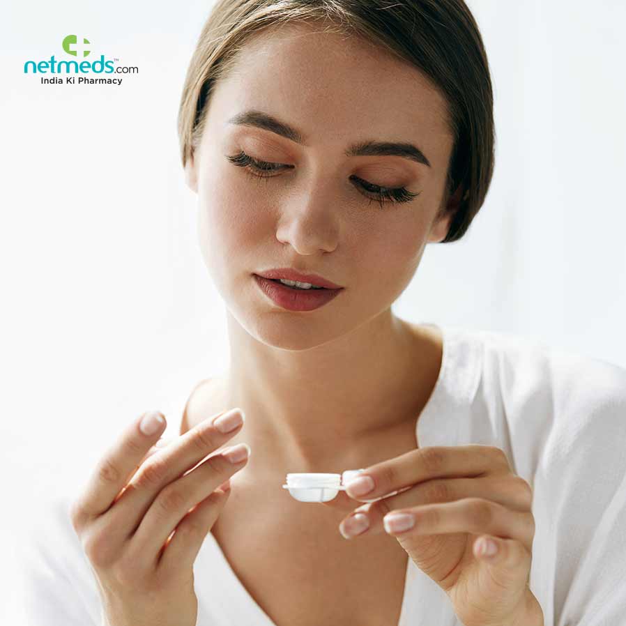 woman using contact lens