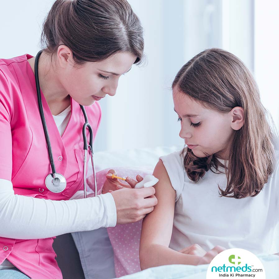 Doctor Giving Injection To A Kid