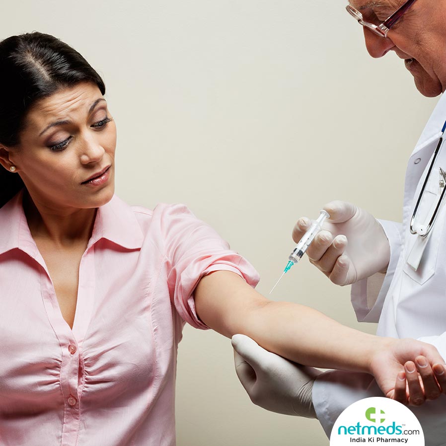Doctor using injection on a patient