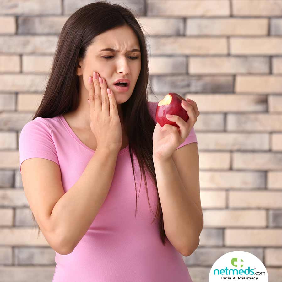 Woman feels tooth sensitivity after biting an apple