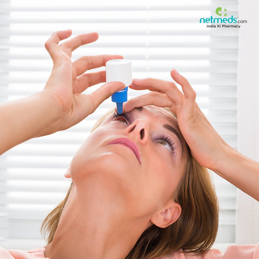 Woman using eyedrops