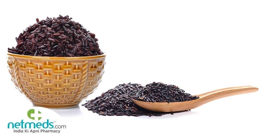 Brown rice in a bowl and in a spoon