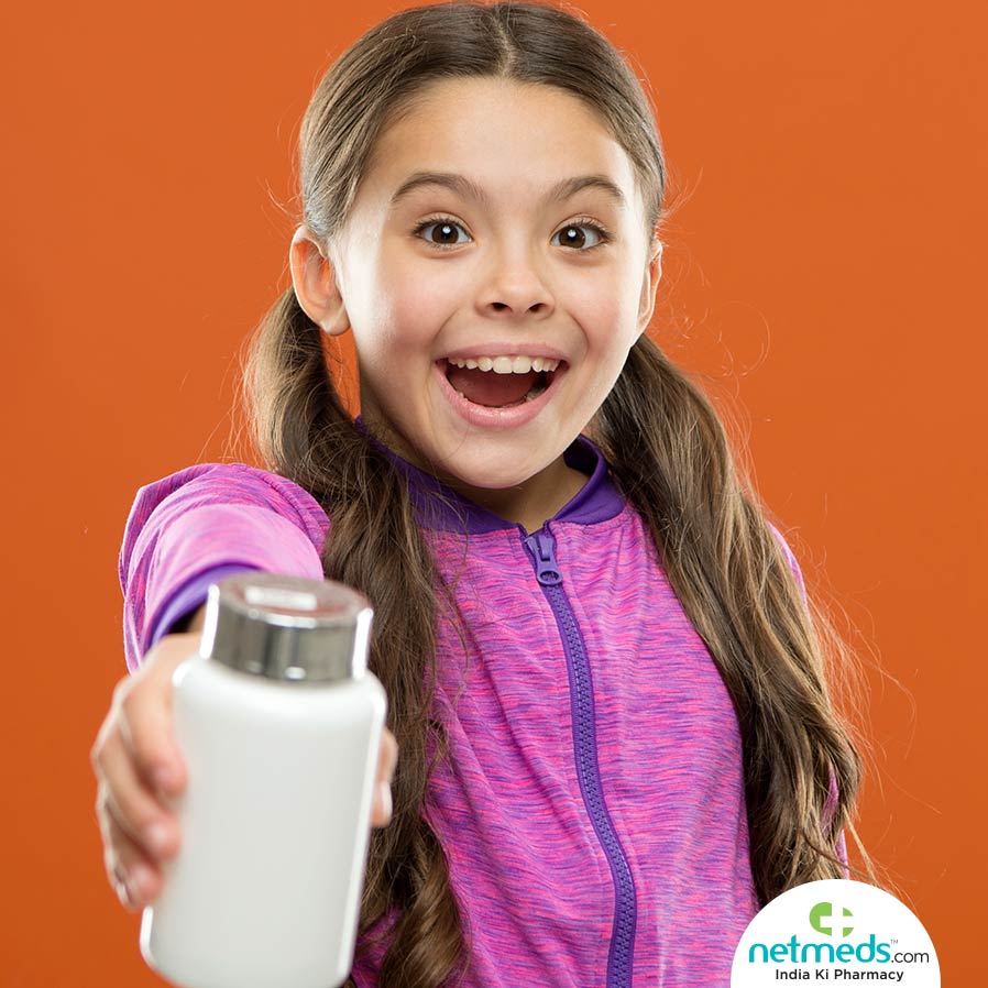 Vitamin Supplements: Girl with milk bottle