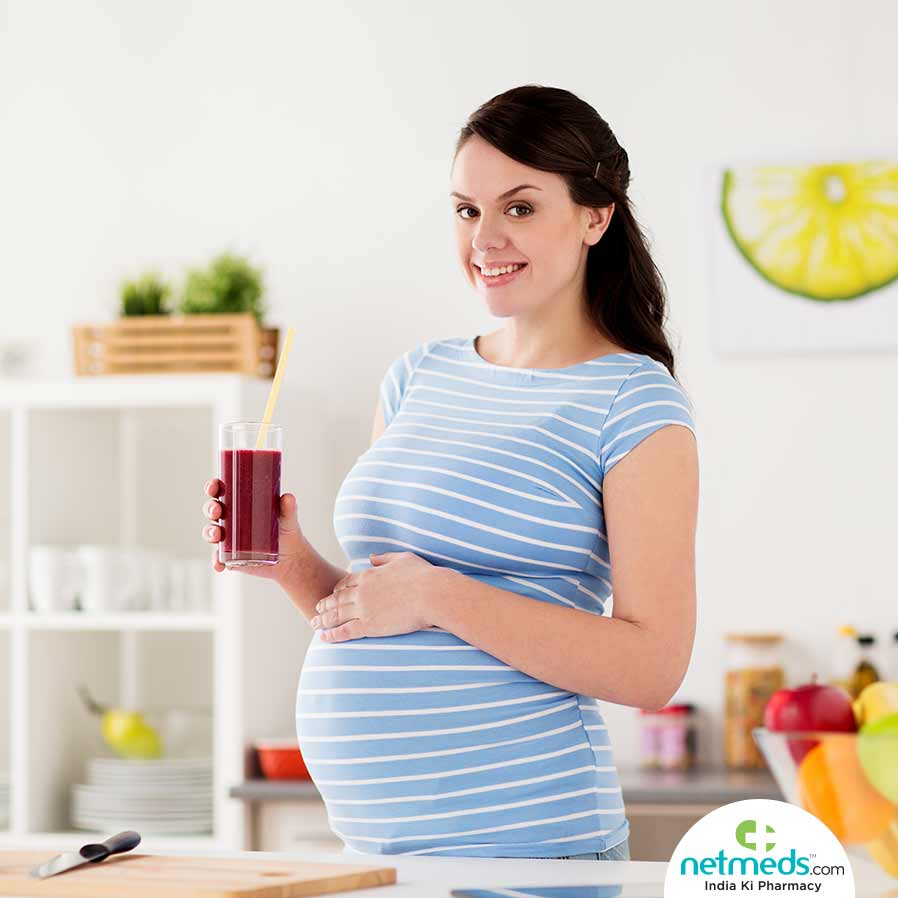 Pregnant Lady With A Juice In Hand