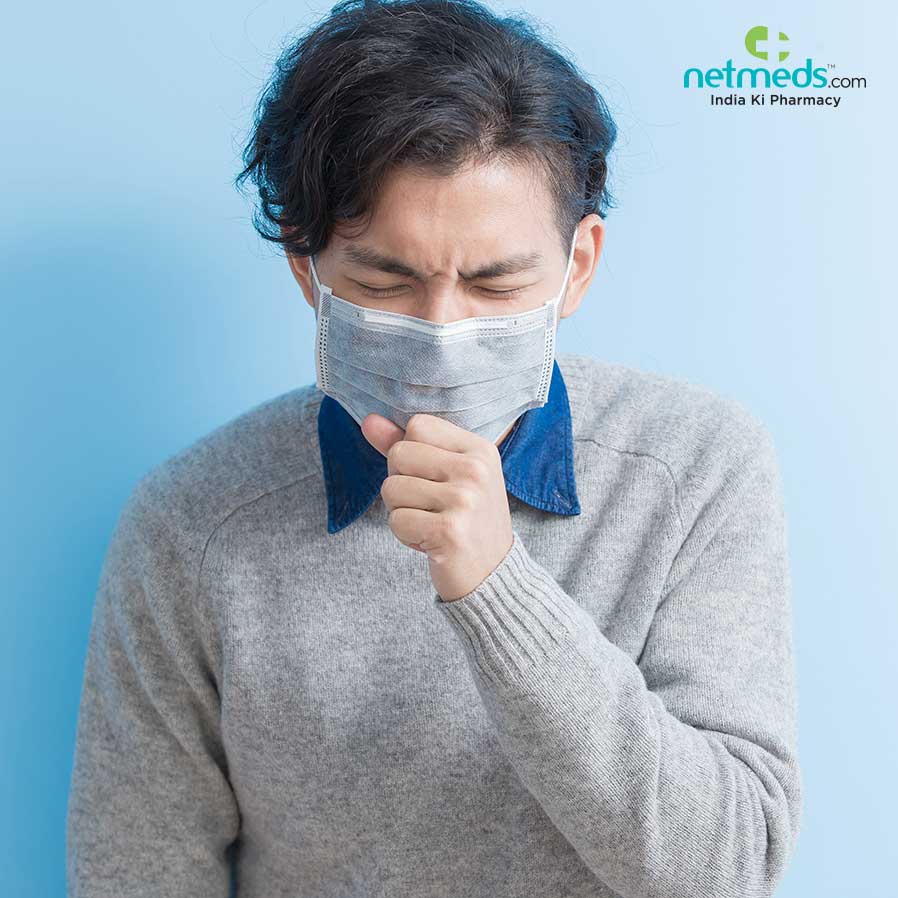 Man coughing with mask on his face