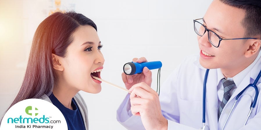 Doctor checking the mouth of the patient