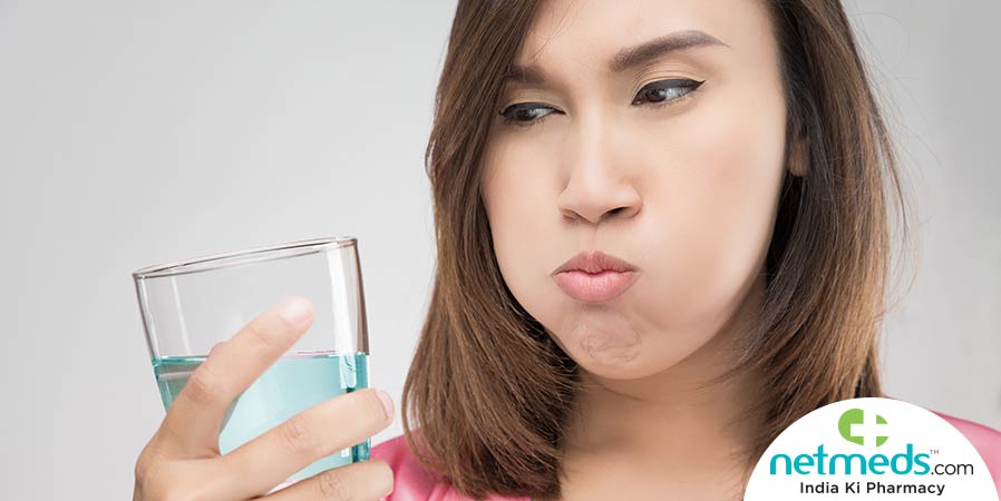 Woman gargling with mouthwash