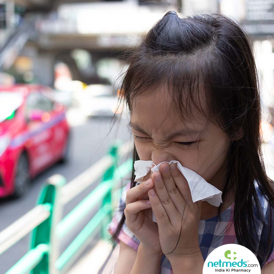 Girl blowing her nose