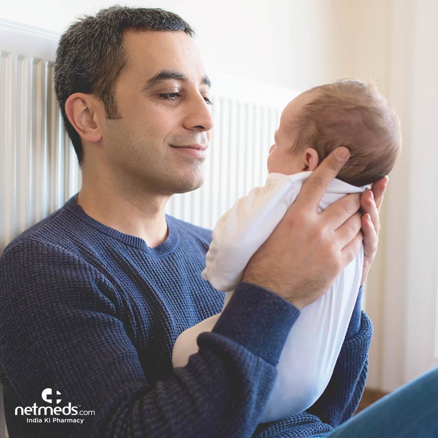 New Dad holding his baby