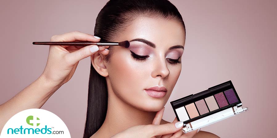 Woman getting eye shadow look
