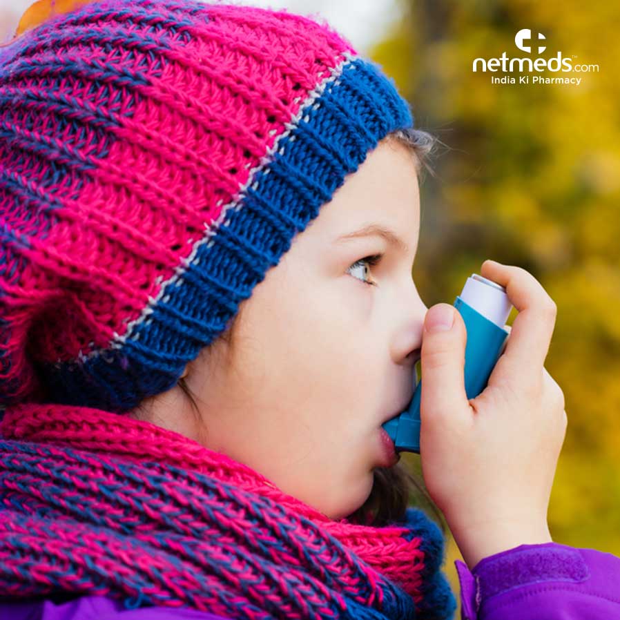 Girl using asthma inhaler